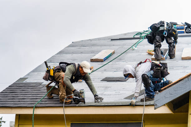 Professional Gutter Installation technician working in Foster, WV